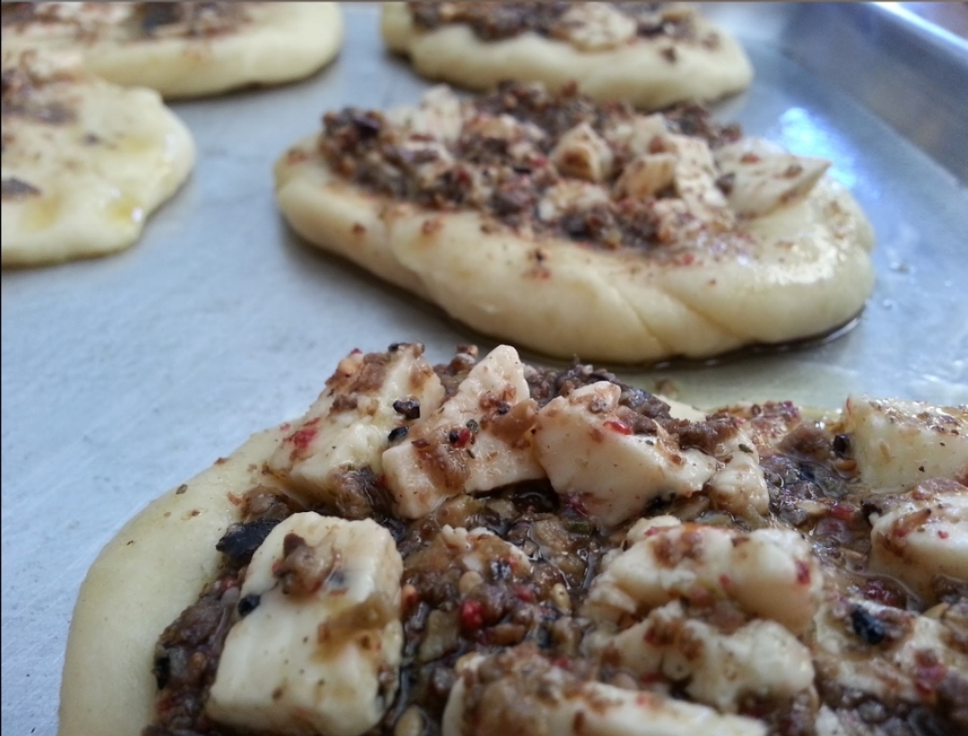 Fresh Baked Bread with our Olive Tapenade, Zataar and Halloumi Cheese