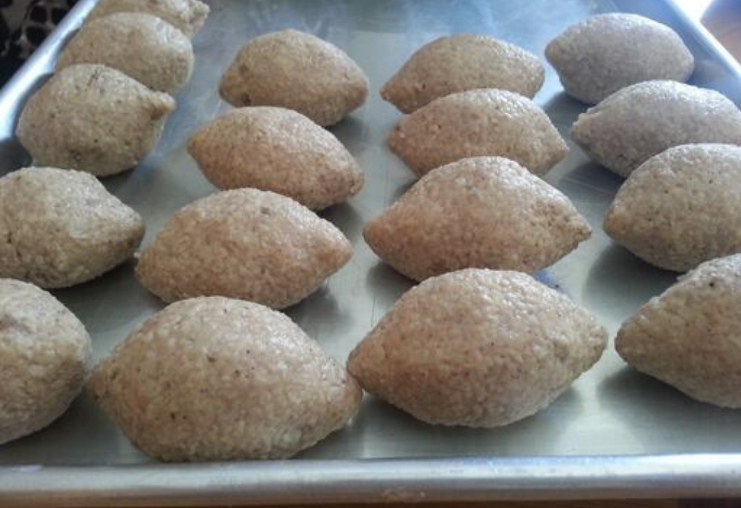 Kibbi (Ground Wheat balls filled with beef, pine nuts & Spices)